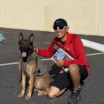 Al Garcia of Alpha-Ro Race Timing with a Merced Police K-9 at the Paws on Patrol Fun Run